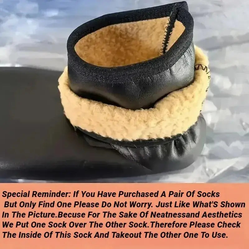 Black leather ankle boot with tan shearling lining and stitched detailing paired with thick fleece middle tube winter socks