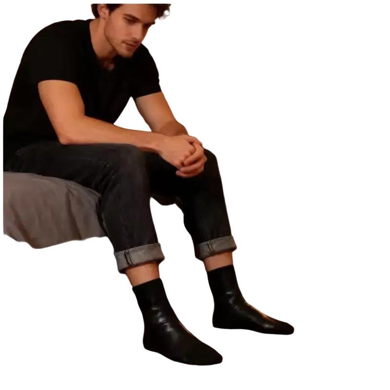 Black leather ankle boots with sleek minimalist design paired with thick fleece middle tube winter socks