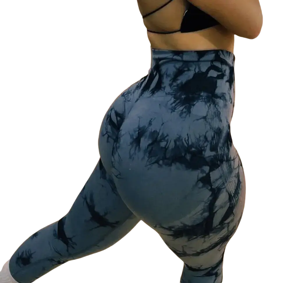 High-waisted seamless scrunch gym leggings in blue and black tie-dye made of stretchy fabric from the back side