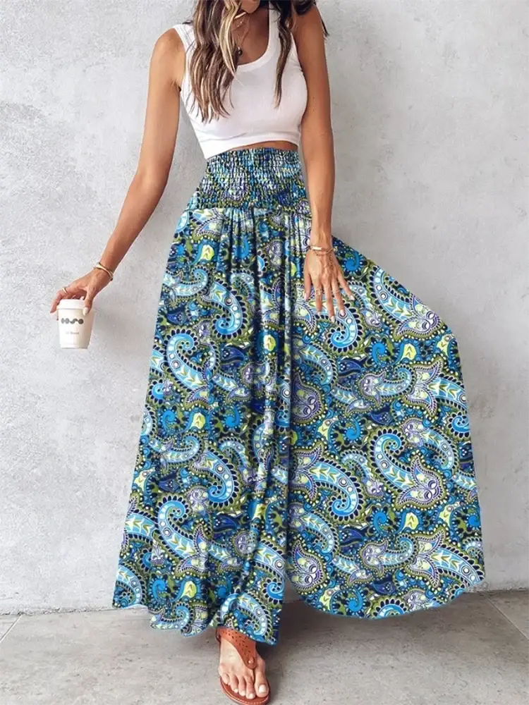 A flowing wide leg skirt with vibrant blue green and purple paisley pattern and elastic waistband tie dye design