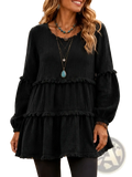 Black textured tiered long sleeve casual top for women with ruffled hem and cuffs in lightweight fabric