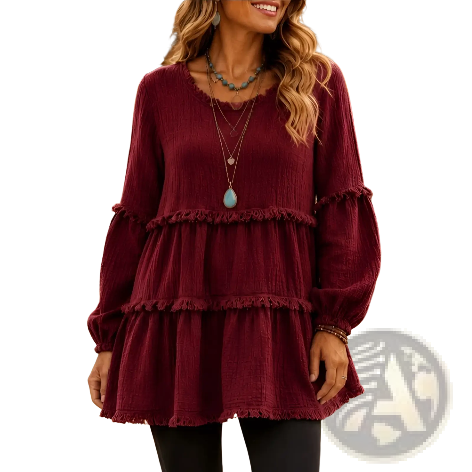 A maroon tiered long sleeve casual top for women with frayed edges and textured fabric