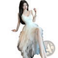 A flowing off-white tiered tulle and lace mesh evening gown with a fitted bodice and delicate lace trim