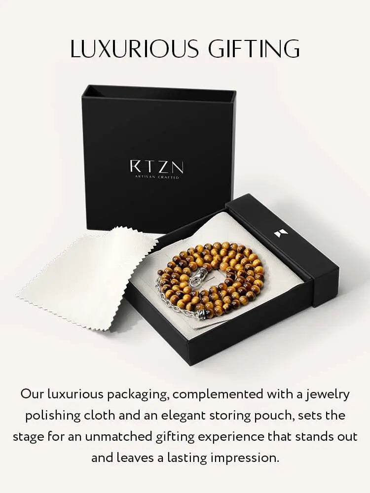 A polished warm-toned tiger eye wooden bead bracelet with stainless steel silver clasp and chain accessory