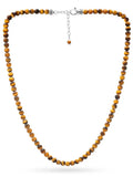 A sleek silver-toned stainless steel toggle clasp with a dangling tiger eye bead on a tiger eye beaded necklace