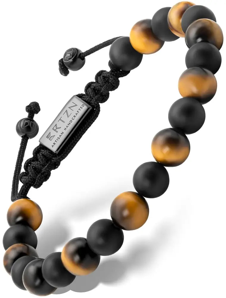 Tulum tiger eye and black onyx adjustable beaded bracelet featuring black and golden tiger eye beads and a silver Britzn tag