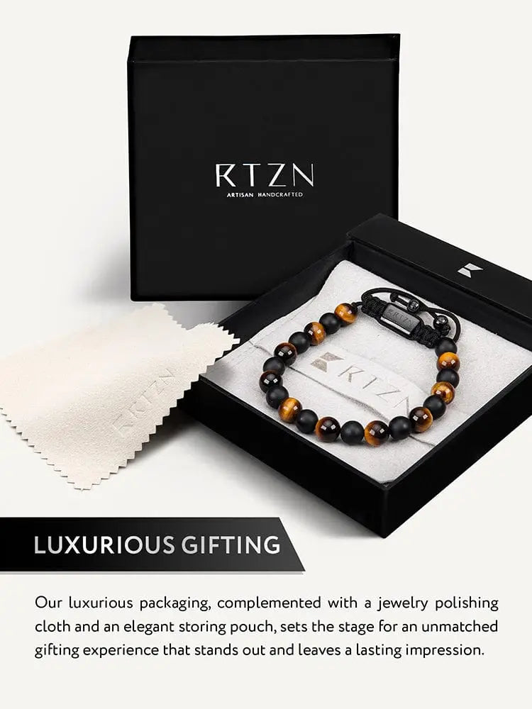 Tulum tiger eye and black onyx adjustable beaded bracelet with black leather cord in rtzn artisan handcrafted gift box