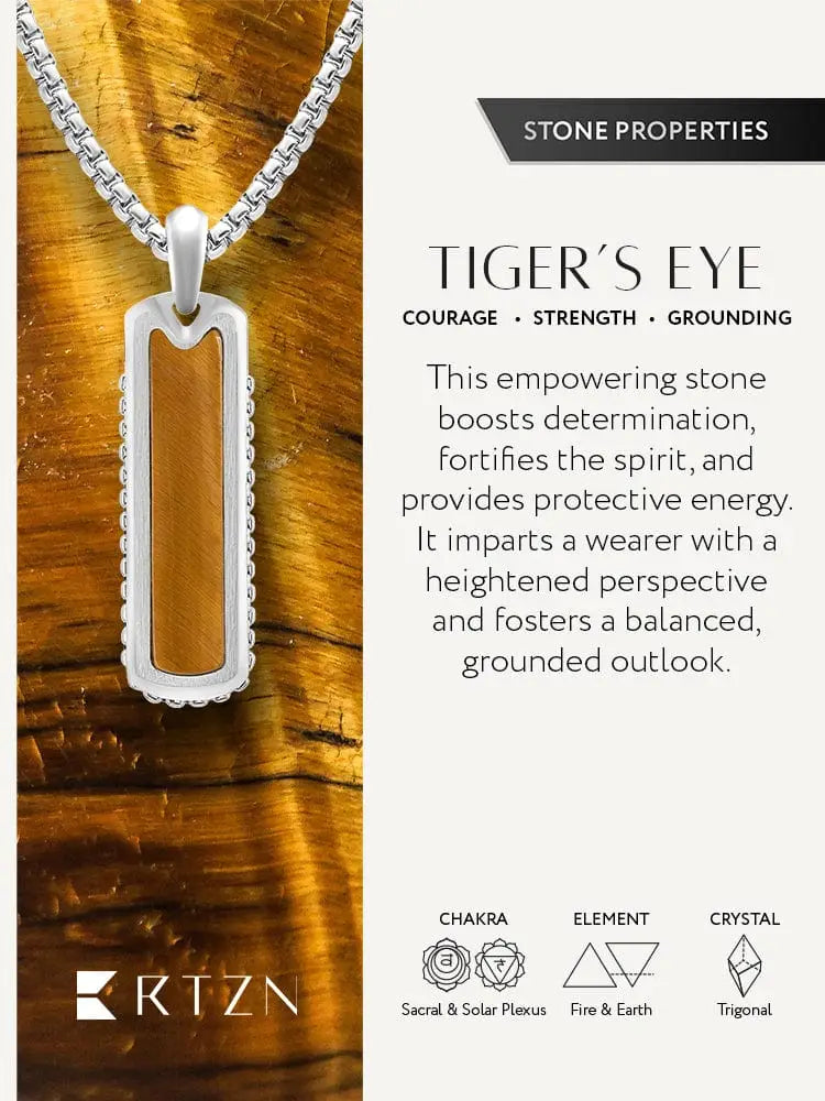 Silver-toned stainless steel rectangular column necklace featuring a central tiger eye stone in an ornate scalloped frame