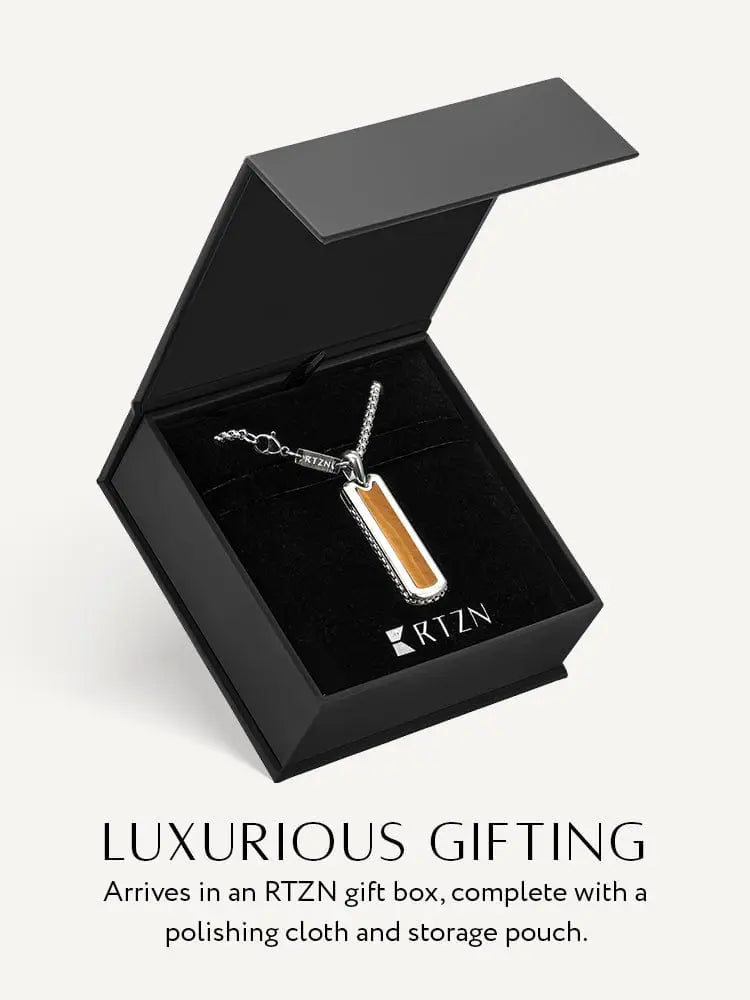 A sleek silver-toned stainless steel tiger eye rectangular column necklace with warm wood inlay and polished edges