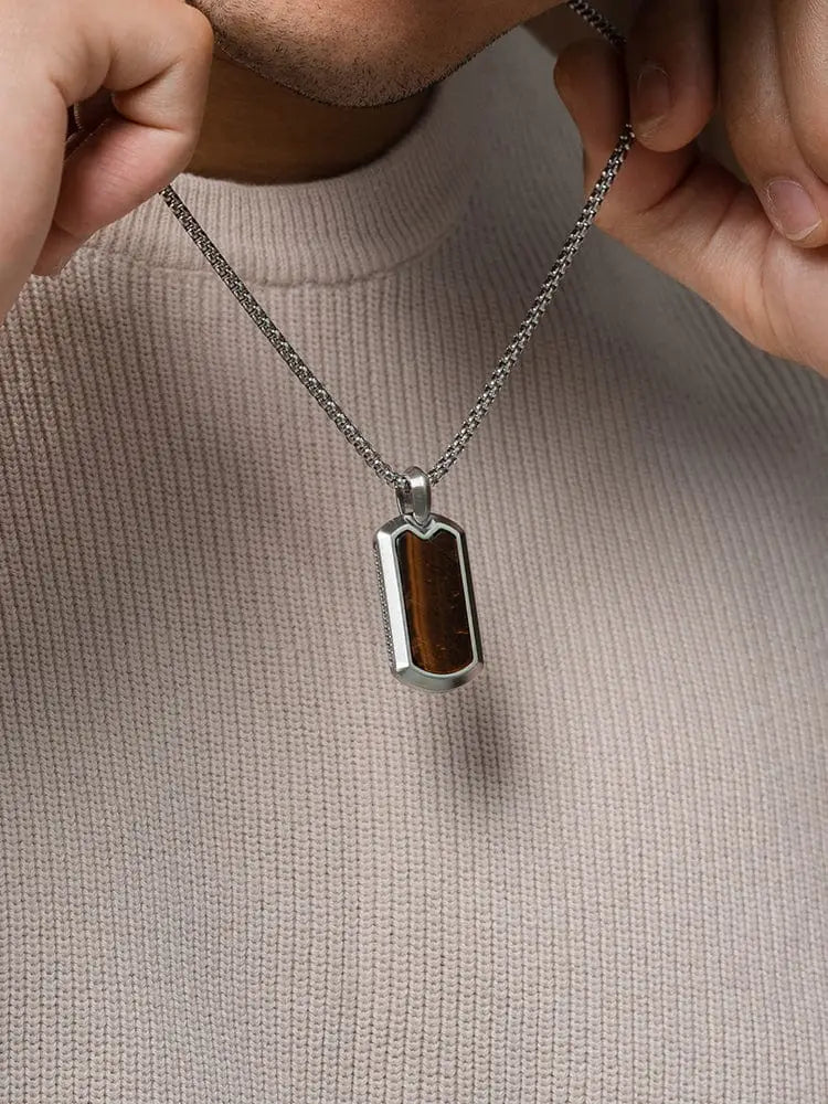 Silver-toned stainless steel dog tag pendant with rectangular amber-brown tiger eye stone inset necklace