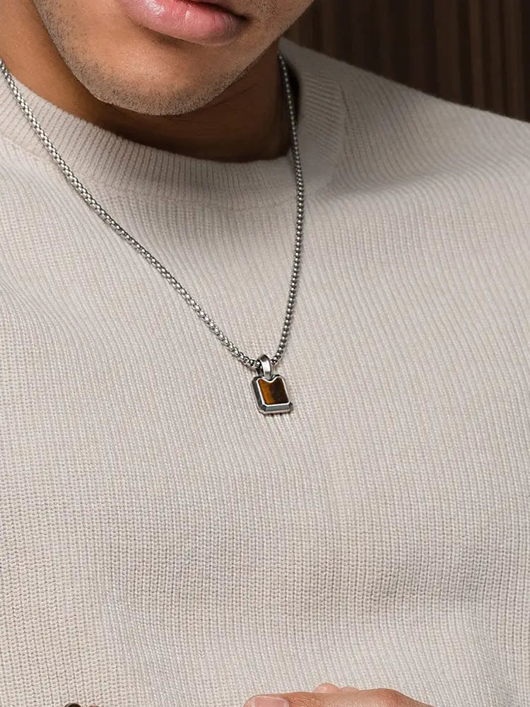 Silver chain necklace with rectangular stainless steel dog tag pendant featuring brown tiger eye stone inset in minimalist design