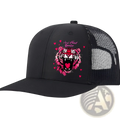 Black trucker hat with vibrant pink tiger graphic and heart breaker text on tan mesh back for men