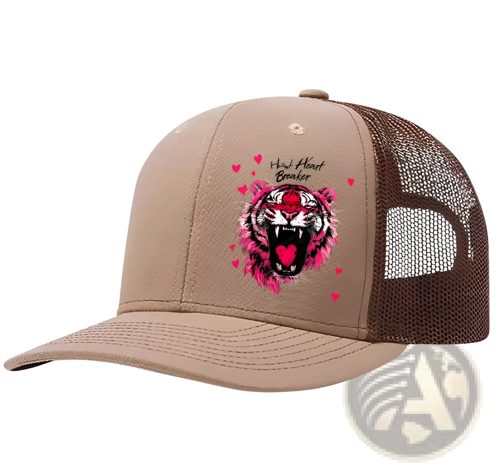 Tan trucker hat with vibrant pink and black tiger graphic and heart breaker text surrounded by small hearts