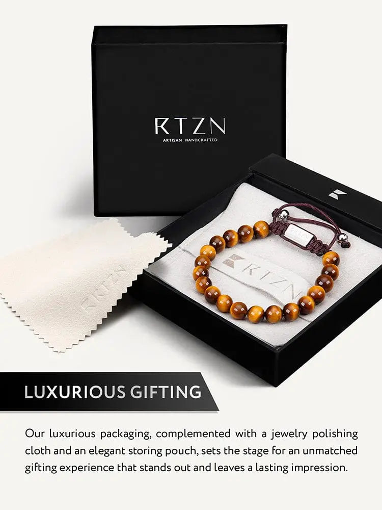 Adjustable bali tiger eye beaded bracelet with brown tiger eye beads silver toned clasp and stainless steel elements