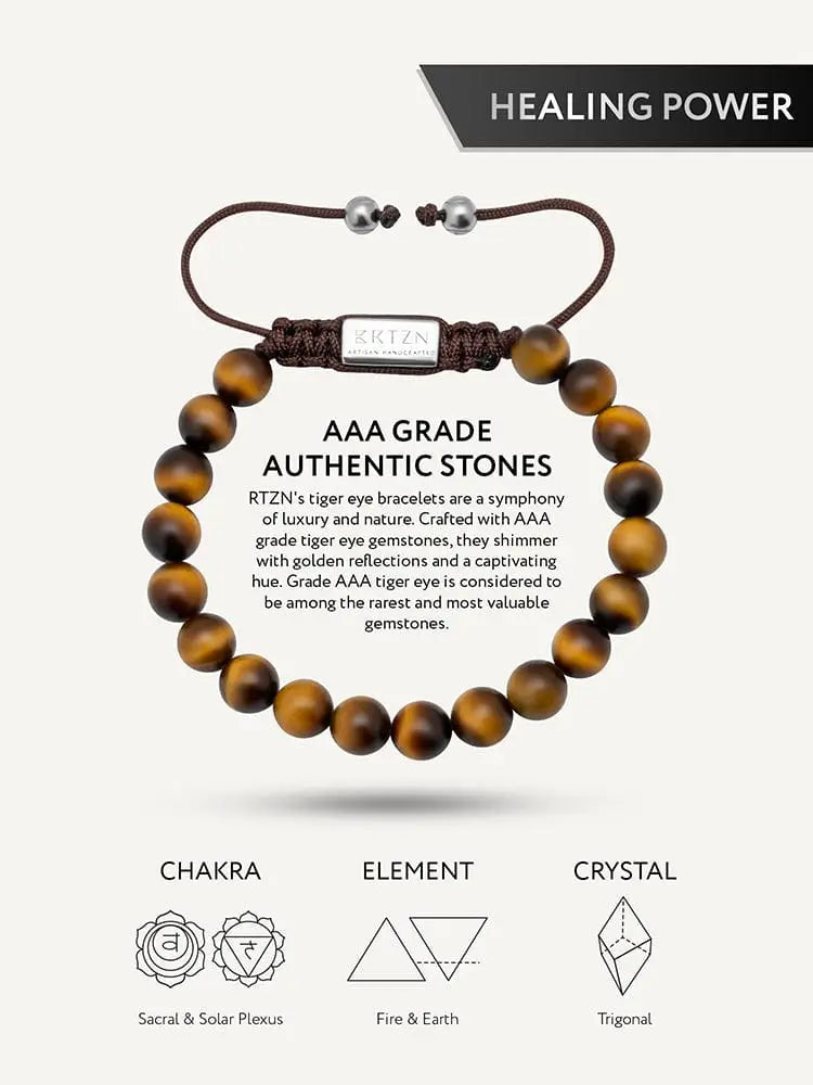 A braided brown cord adjustable Bali tiger eye beaded bracelet with stainless steel silver-toned rtzn plate