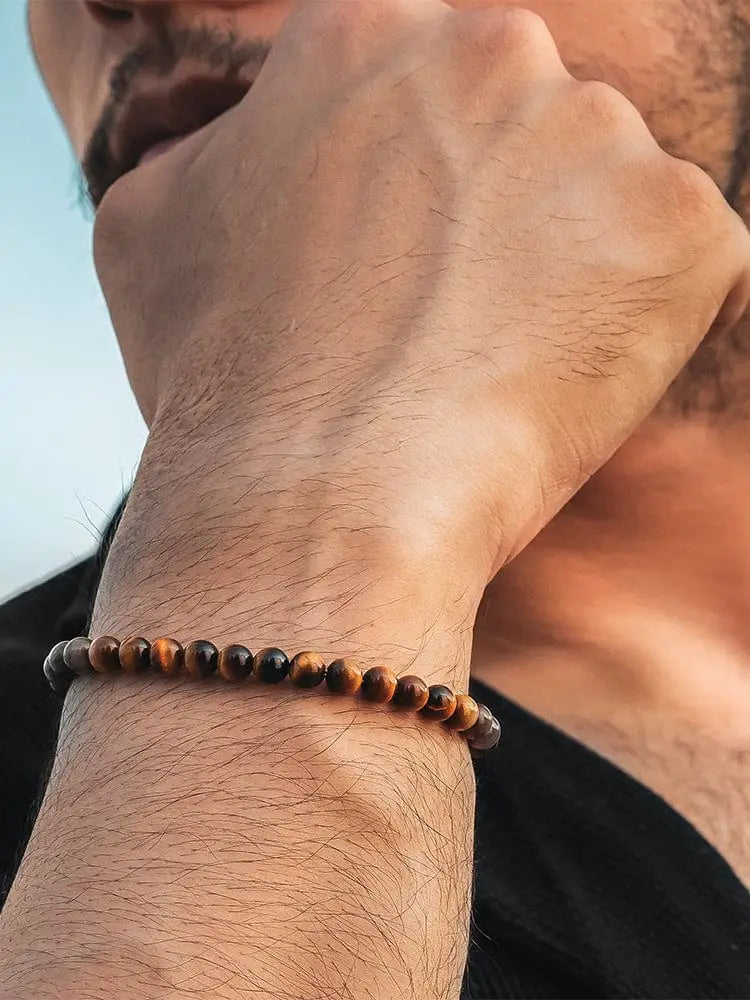 Tiger eye beaded bracelet for men with natural brown and golden hues and a silver chain clasp