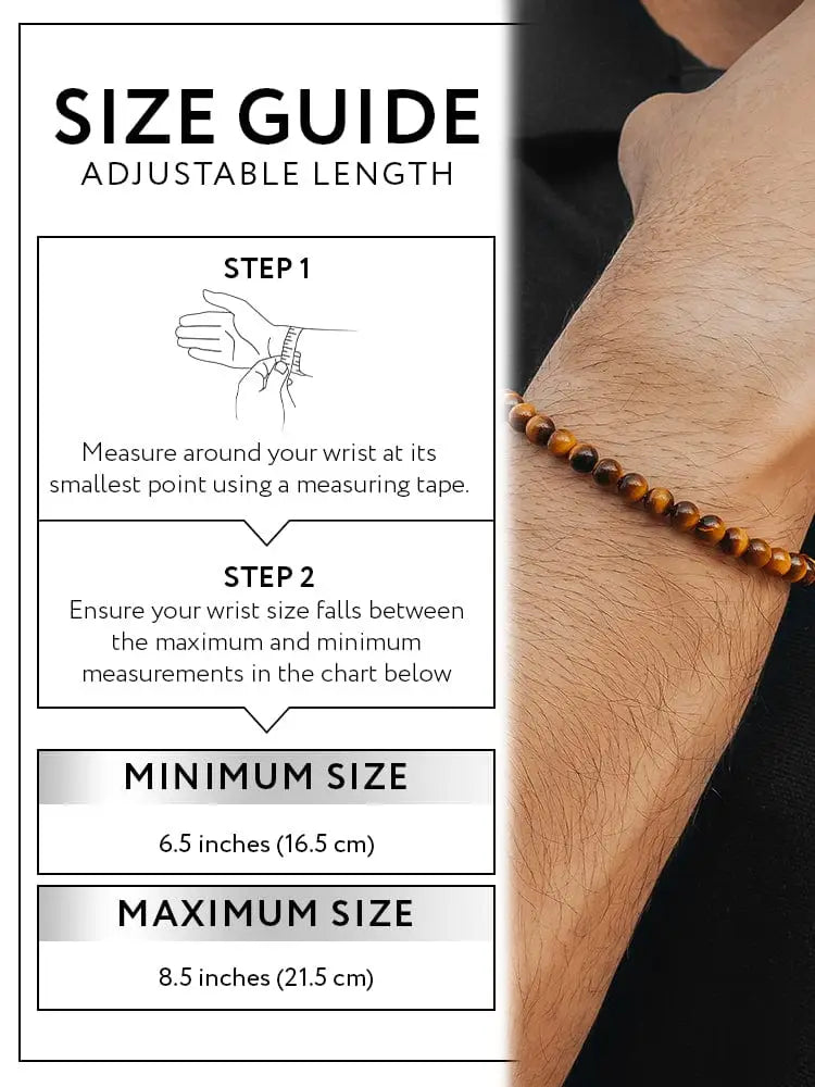 Tiger eye beaded bracelet with alternating brown and golden stones and silver chain clasp worn on a wrist