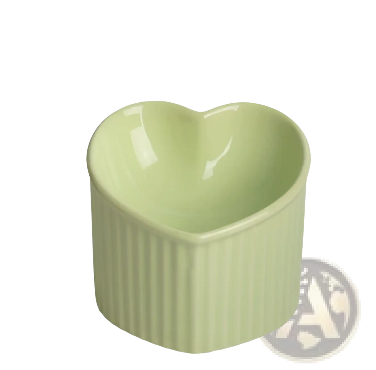 A heart-shaped ceramic cat bowl from the tilted ceramic cat bowl set 4 pack with pale green glaze and vertical ridges