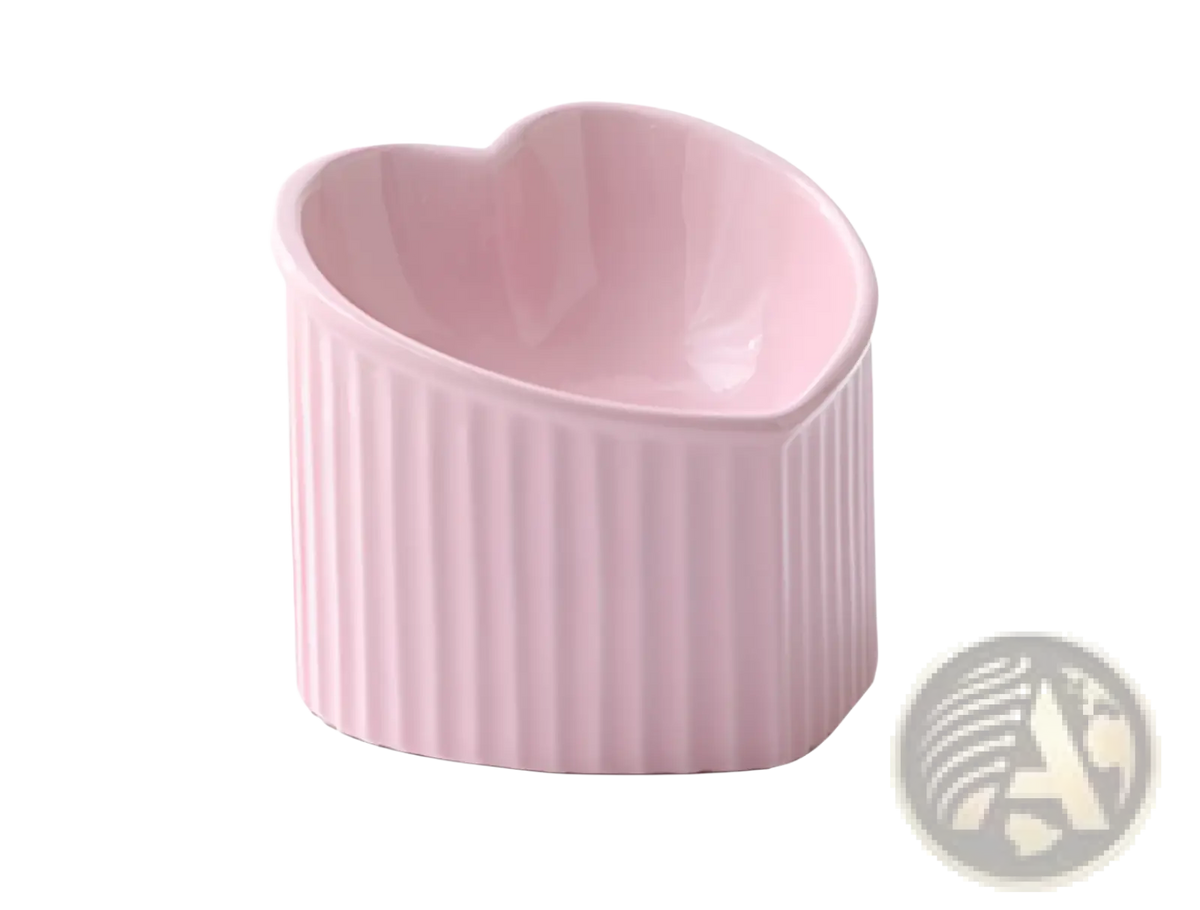 Pink ceramic heart-shaped ramekin with vertical ridges from tilted ceramic cat bowl set 4 pack