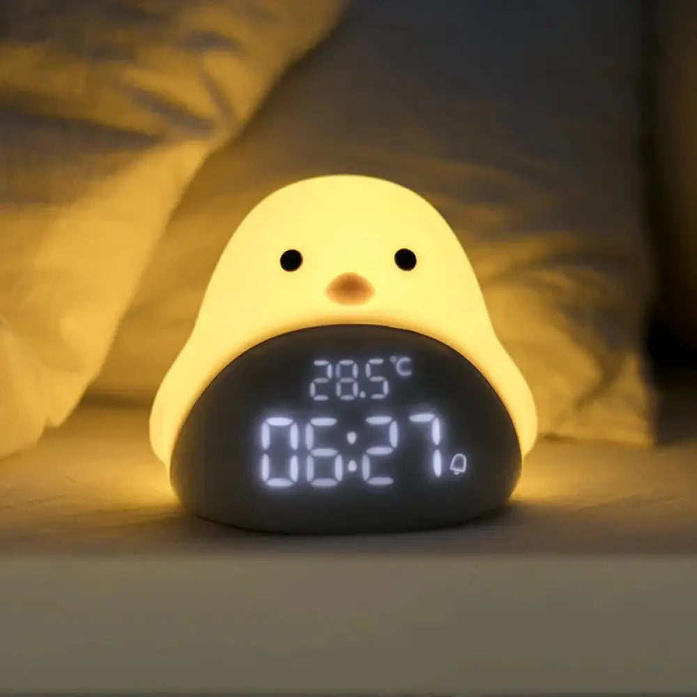 Yellow silicone chick-shaped night light with digital time and temperature display from Time Bird smart clock series