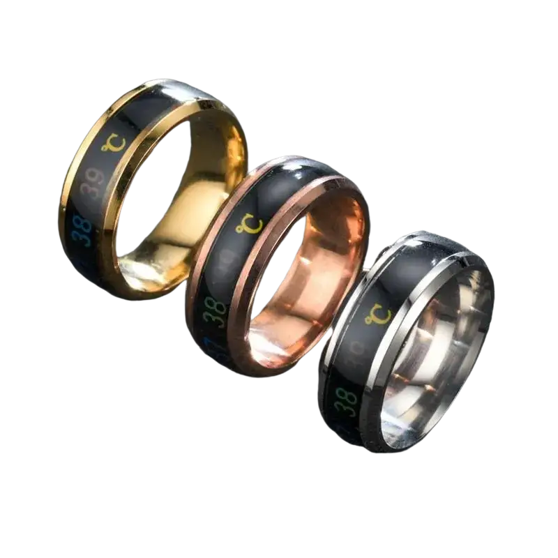 Titanium temperature sensitive mood rings in gold rose gold and silver with black enamel bands showing 38°c temperature