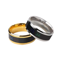 Two sleek gold and silver titanium temperature sensitive mood rings with black inlays displaying glowing green numbers