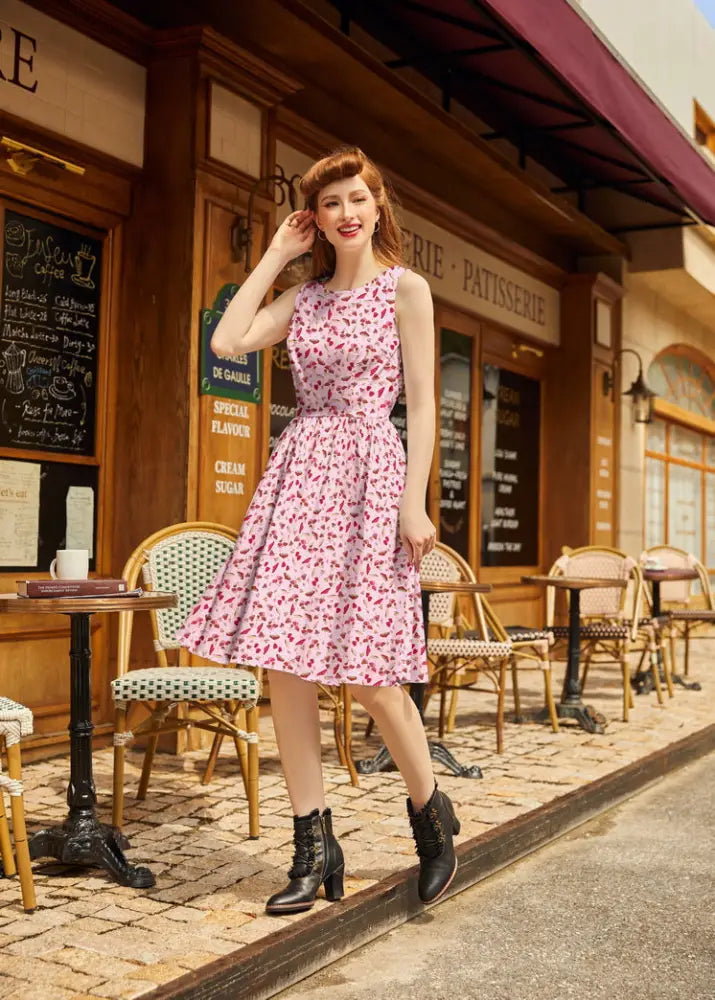 A pink cotton 1950s toadstool print sleeveless dress with fitted bodice and flared a-line skirt