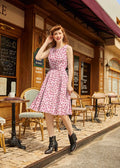 A pink cotton 1950s toadstool print sleeveless dress with fitted bodice and flared a-line skirt