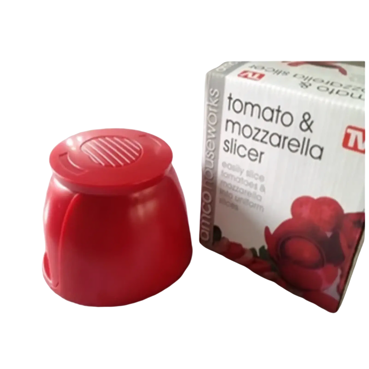 Red plastic tomato slicer and mozzarella cutter kitchen tool with a ridged top lid for easy slicing
