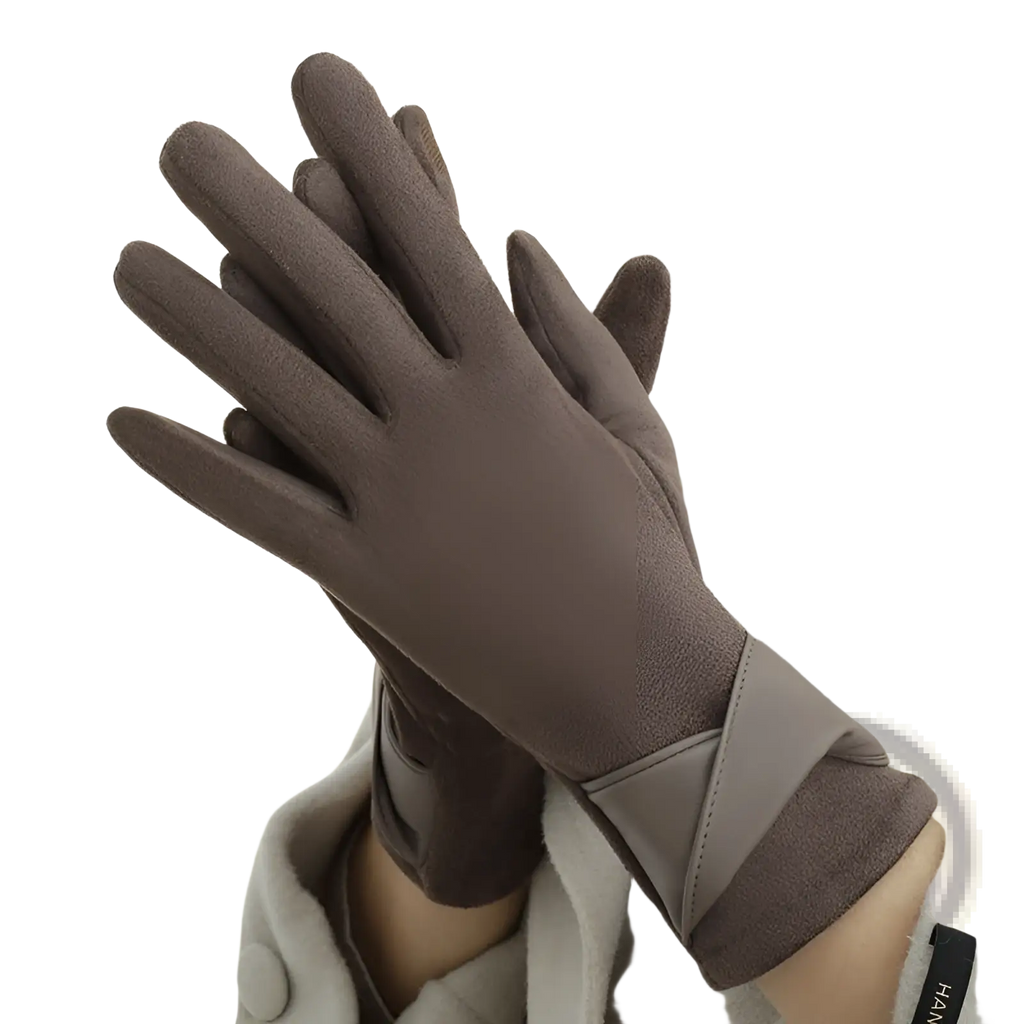 A pair of brown suede touchscreen fleece lined bow gloves with a sleek minimalist design and wrist contrast panel