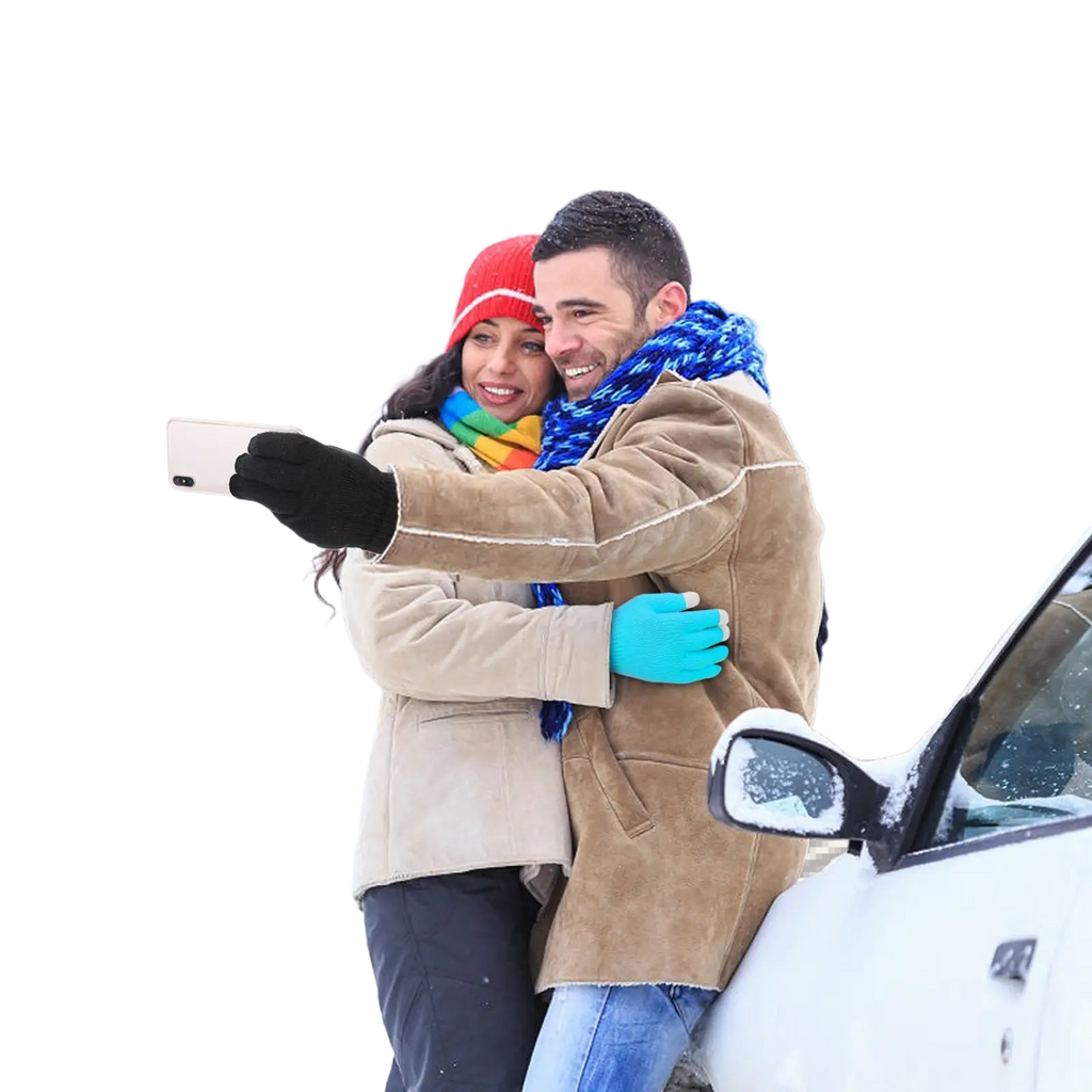 A man wearing warm unisex touchscreen winter knit gloves holds a white smartphone in winter attire