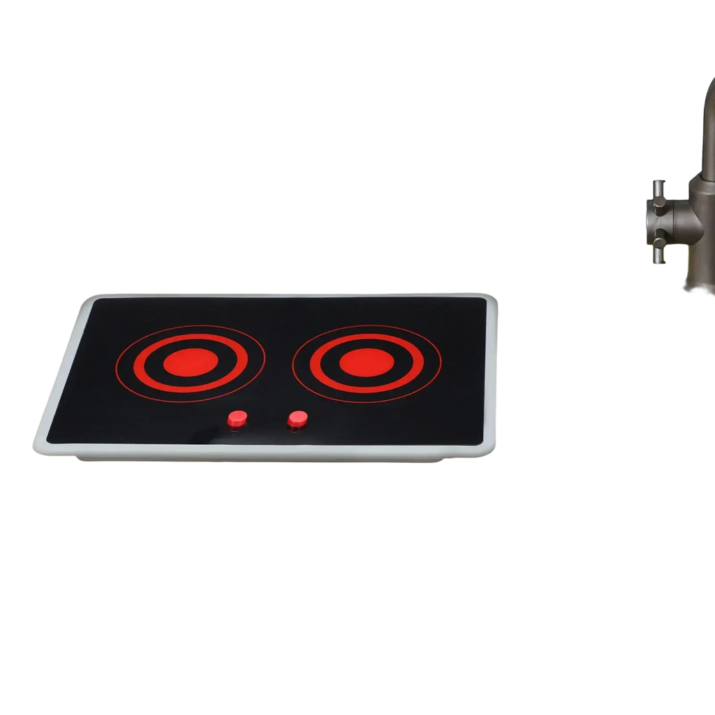 Black toy induction stove with red circular heating elements and sound and light features on beige countertop