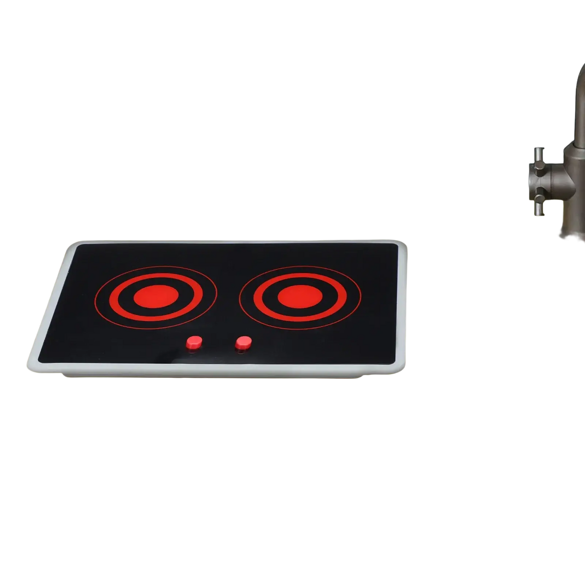 Black toy induction stove with red circular heating elements and sound and light features on beige countertop