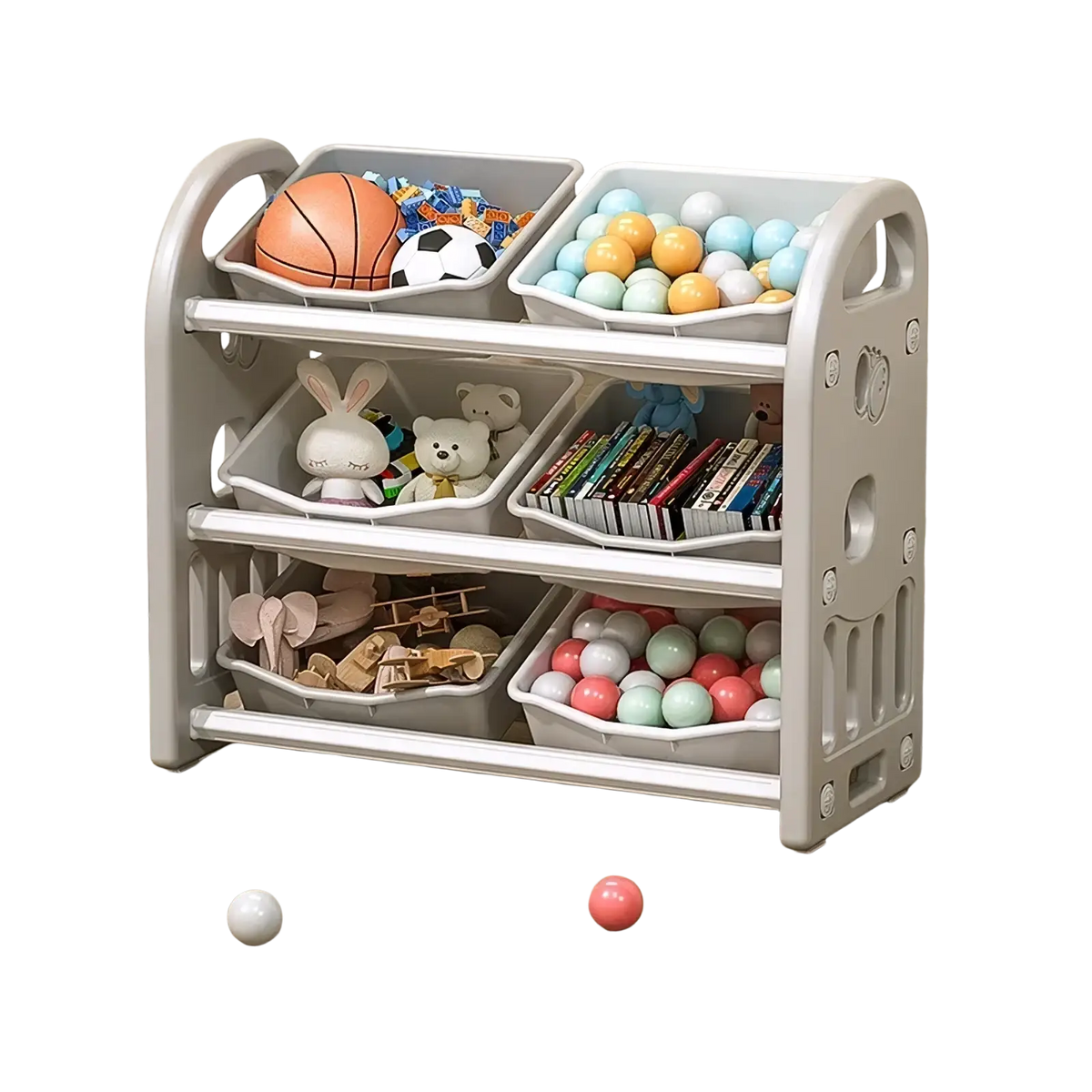 Gray plastic toy storage cabinet with three tiers and multiple compartments holding balls books and stuffed animals
