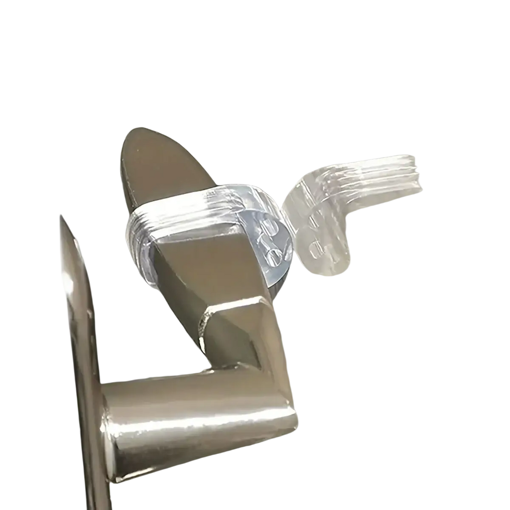 Transparent door handle wall protector made of clear flexible plastic that securely wraps around a metallic handle