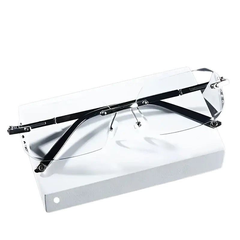 Black rimless rectangular reading glasses with transparent lenses and metallic hinges for casual wear displayed on white box
