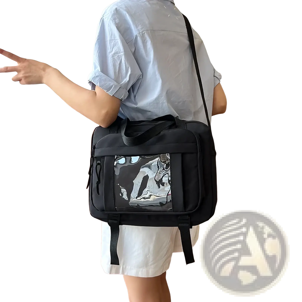 Black canvas travel messenger bag with transparent front panel featuring black and white graphic design