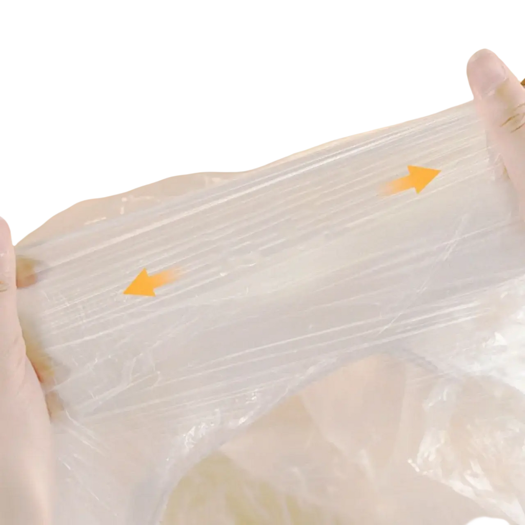 Transparent plastic furniture dust cover with visible texture and reinforced ridges for durability and protection
