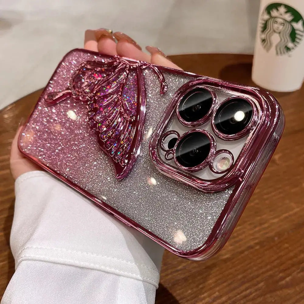 Back side of a shatterproof quicksand butterfly crystal phone case with sparkling pink and silver glitter and 3d butterfly wings
