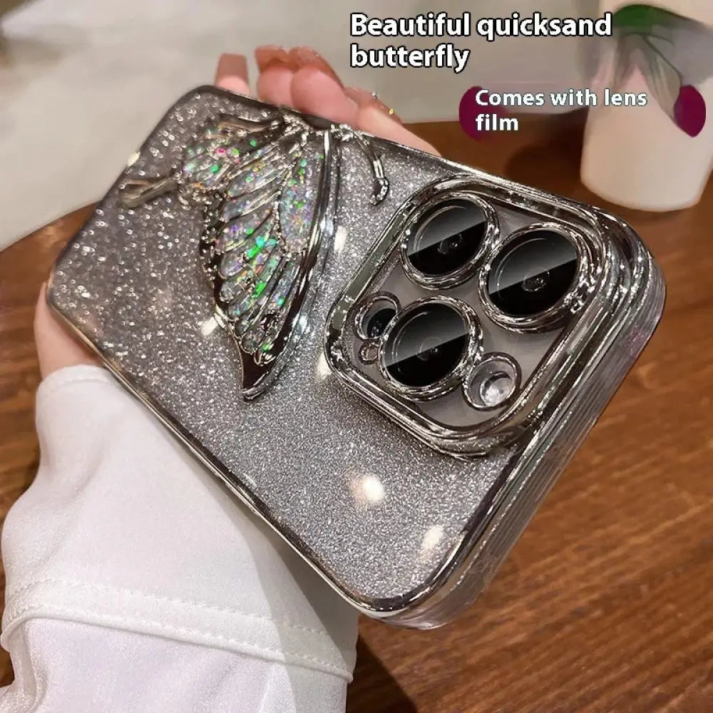 Silver glitter shatterproof quicksand butterfly crystal phone case back with detailed rhinestone and crystal wing design