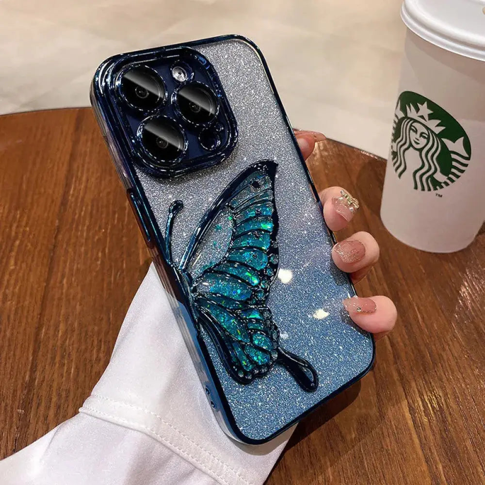 Back side of a shatterproof quicksand butterfly crystal phone case with sparkling blue glitter and a teal 3d butterfly design