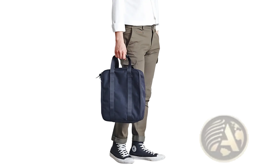 Navy blue canvas travel bag with sturdy handles and minimalist design for storage and organization
