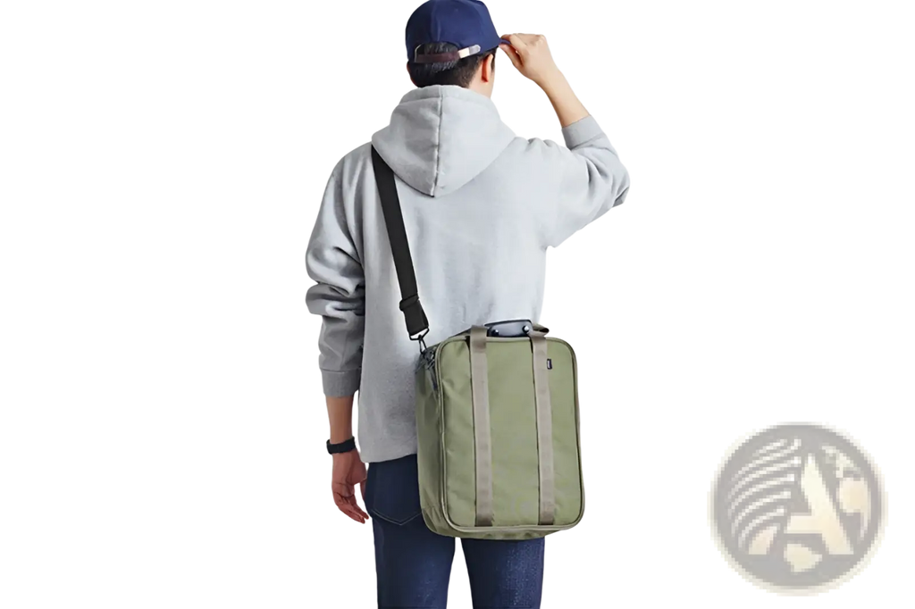 Olive green cotton canvas travel bag with black strap and reinforced side panels for organized storage