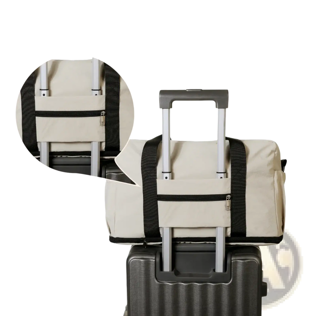 Beige fabric travel duffel bag with black straps and fixing belt designed to attach securely to suitcase expandable lightweight luggage