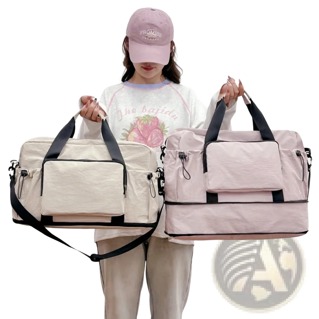 Two expandable lightweight travel duffel bags in cream with black accents and soft pink with black trim