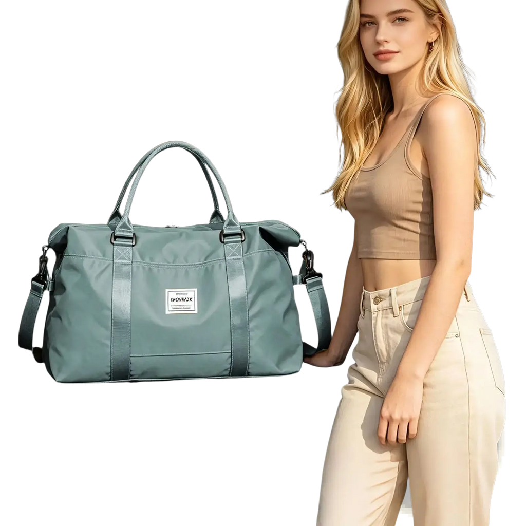 A sleek light teal nylon travel duffel bag with large capacity sturdy handles and detachable shoulder strap