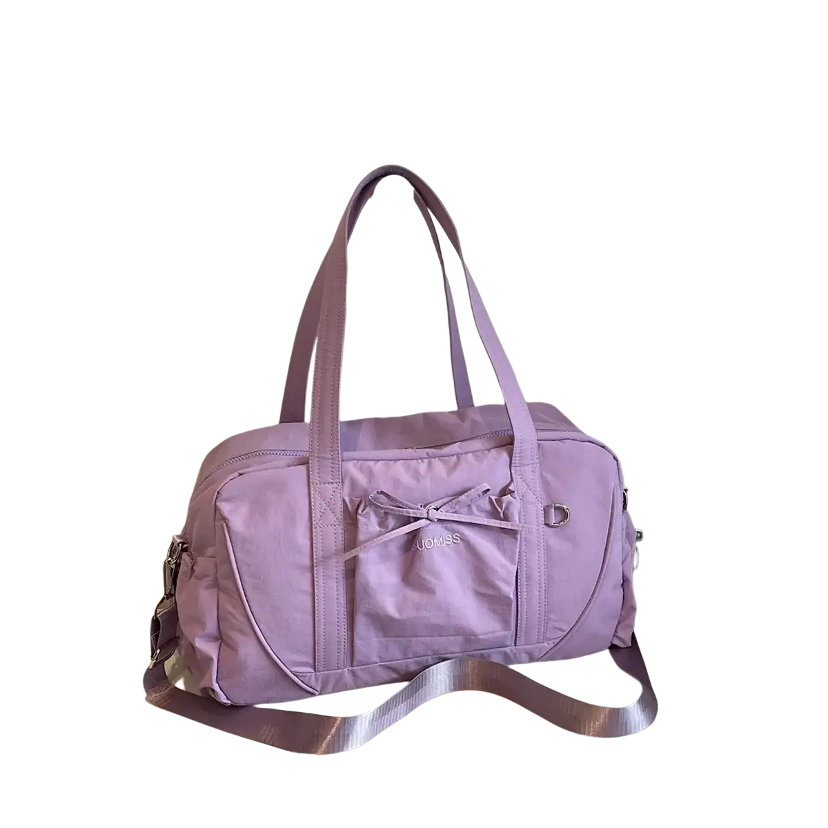 A lavender durable nylon travel duffel bag with large capacity front pocket bow detail and adjustable shoulder strap