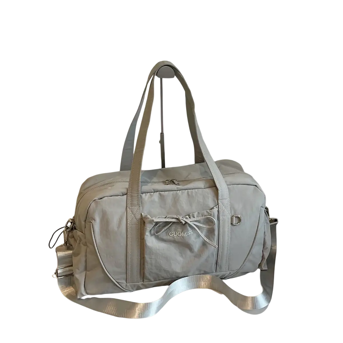 Light gray guomiss large capacity nylon travel duffel bag with silver zipper pull adjustable shoulder strap and front bow pocket
