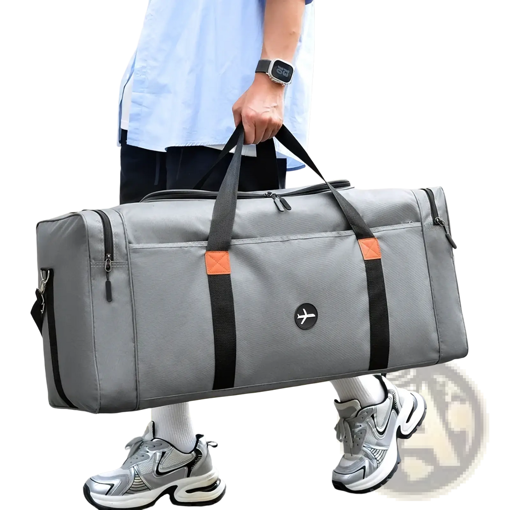 Travel duffel bag sports luggage crossbody in gray with black straps orange accent patches and small circular logo on front