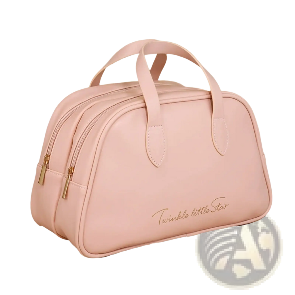 A soft pink waterproof leather travel makeup bag with structured design gold-toned zippers and handles